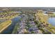 Aerial view of houses in a golf course community near a lake at 1141 Jameson Greens Dr # 3, Sun City Center, FL 33573