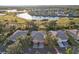 Aerial view of a community with houses, golf course, and lakes at 1141 Jameson Greens Dr # 3, Sun City Center, FL 33573