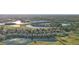 Aerial view of houses and a golf course community near a lake at 1141 Jameson Greens Dr # 3, Sun City Center, FL 33573