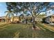 Home with a large backyard, screened lanai, and lush landscaping at 1141 Jameson Greens Dr # 3, Sun City Center, FL 33573