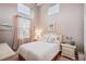 Cozy bedroom with a queen-size bed and plenty of natural light at 1141 Jameson Greens Dr # 3, Sun City Center, FL 33573