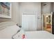 Spacious bedroom with double doors leading to the bathroom at 1141 Jameson Greens Dr # 3, Sun City Center, FL 33573