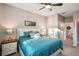 King-size bed and en-suite bathroom in a well-lit and cozy bedroom at 1141 Jameson Greens Dr # 3, Sun City Center, FL 33573