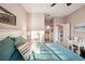 Bright bedroom with king-size bed, en-suite bathroom, and a workspace at 1141 Jameson Greens Dr # 3, Sun City Center, FL 33573