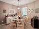 Charming dining room with a round table and white chairs at 1141 Jameson Greens Dr # 3, Sun City Center, FL 33573