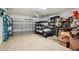 Garage with golf cart, shelving, and plenty of storage at 1141 Jameson Greens Dr # 3, Sun City Center, FL 33573