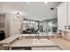 Kitchen features granite countertops, stainless steel appliances, and an open layout to the living area at 1141 Jameson Greens Dr # 3, Sun City Center, FL 33573