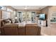 Spacious living room with leather couches and a view of a lanai at 1141 Jameson Greens Dr # 3, Sun City Center, FL 33573