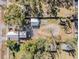Aerial view of property and surrounding area, including trees and other buildings at 14035 21St St, Dade City, FL 33525
