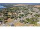 Aerial view showing property and surrounding neighborhood, including a lake at 14035 21St St, Dade City, FL 33525