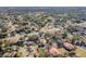 Wide aerial view of the property and surrounding neighborhood at 14035 21St St, Dade City, FL 33525