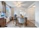 Dining area with four chairs and a view into the living room at 14035 21St St, Dade City, FL 33525