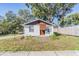 Charming one-story home with a brown roof and well-maintained lawn at 14035 21St St, Dade City, FL 33525