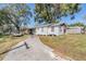 White house with carport and spacious backyard at 14035 21St St, Dade City, FL 33525