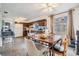 Kitchen and dining area with wood cabinets and laminate floors at 14035 21St St, Dade City, FL 33525
