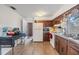 Kitchen features wood cabinets and white appliances at 14035 21St St, Dade City, FL 33525