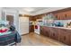 Kitchen features wood cabinets and white appliances at 14035 21St St, Dade City, FL 33525