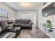 Cozy living room with leather couches and dark floors at 14035 21St St, Dade City, FL 33525