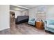 Living room with two blue accent chairs and dark floors at 14035 21St St, Dade City, FL 33525