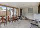 Screened porch with table, chairs, and grill at 14035 21St St, Dade City, FL 33525