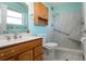 Updated bathroom with walk-in shower, grab bars, and new vanity at 1518 Chevy Chase Dr, Sun City Center, FL 33573