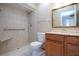 Modern bathroom with a large vanity and a walk-in shower at 1518 Chevy Chase Dr, Sun City Center, FL 33573