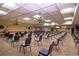 Large community room with rows of chairs, perfect for events at 1518 Chevy Chase Dr, Sun City Center, FL 33573