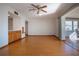 Open dining area with wood floors and ceiling fan at 1518 Chevy Chase Dr, Sun City Center, FL 33573