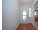 Bright entryway with tile floor and kitchen view at 1518 Chevy Chase Dr, Sun City Center, FL 33573