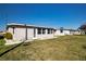Ranch style home with a large backyard and updated siding at 1518 Chevy Chase Dr, Sun City Center, FL 33573