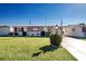 Ranch-style home with carport and landscaped lawn at 1518 Chevy Chase Dr, Sun City Center, FL 33573