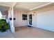 Front door entry with adjacent garage at 1518 Chevy Chase Dr, Sun City Center, FL 33573