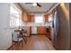 Eat-in kitchen with stainless steel appliances and wood cabinets at 1518 Chevy Chase Dr, Sun City Center, FL 33573
