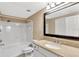 Clean bathroom with white vanity, granite countertop, and large mirror at 1810 E Palm Ave # 5113, Tampa, FL 33605