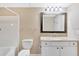 Bathroom features a tub, toilet, and vanity with granite countertop at 1810 E Palm Ave # 5113, Tampa, FL 33605