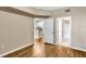 Bedroom with wood-look floors, access to bathroom and kitchen at 1810 E Palm Ave # 5113, Tampa, FL 33605