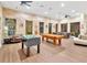 Game room features a pool table, foosball, and comfortable seating at 1810 E Palm Ave # 5113, Tampa, FL 33605