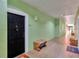 Building hallway with access to unit and seating at 1810 E Palm Ave # 5113, Tampa, FL 33605