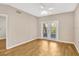 Spacious living room featuring wood-look floors and access to a private balcony at 1810 E Palm Ave # 5113, Tampa, FL 33605