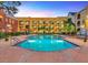 Refreshing community swimming pool with surrounding patio at 1810 E Palm Ave # 5113, Tampa, FL 33605