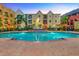 Inviting community pool with surrounding brick patio at 1810 E Palm Ave # 5113, Tampa, FL 33605
