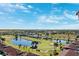 Aerial view of community with golf course and pond at 2825 Terra Ceia Bay Blvd # 1902, Palmetto, FL 34221