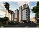 Multi-story building with parking and palm trees at sunset at 2825 Terra Ceia Bay Blvd # 1902, Palmetto, FL 34221