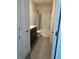 Bathroom with dark brown vanity and bathtub at 3005 Suncoast Blend Dr, Odessa, FL 33556