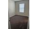 Bright bedroom featuring grey carpeting and a window at 3005 Suncoast Blend Dr, Odessa, FL 33556