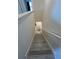 Modern light grey wood-look laminate staircase at 3005 Suncoast Blend Dr, Odessa, FL 33556