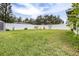 Spacious grassy backyard with shed and fence at 3411 28Th E St, Bradenton, FL 34208