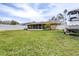 Large backyard with screened patio and boat at 3411 28Th E St, Bradenton, FL 34208