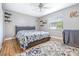 Main bedroom with a king-size bed and wood floors at 3411 28Th E St, Bradenton, FL 34208