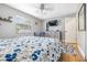 Bright bedroom with a floral comforter and plenty of natural light at 3411 28Th E St, Bradenton, FL 34208